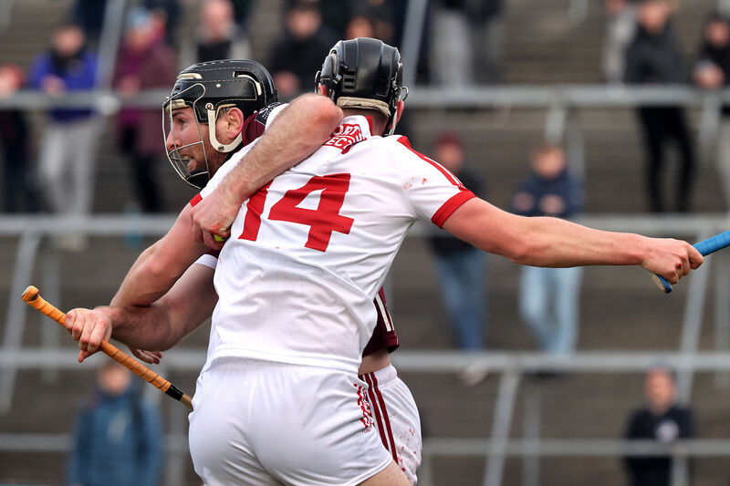 Galway's Padraic Mannion is held up by Padraig Power of Cork. Picture: INPHO/Bryan Keane