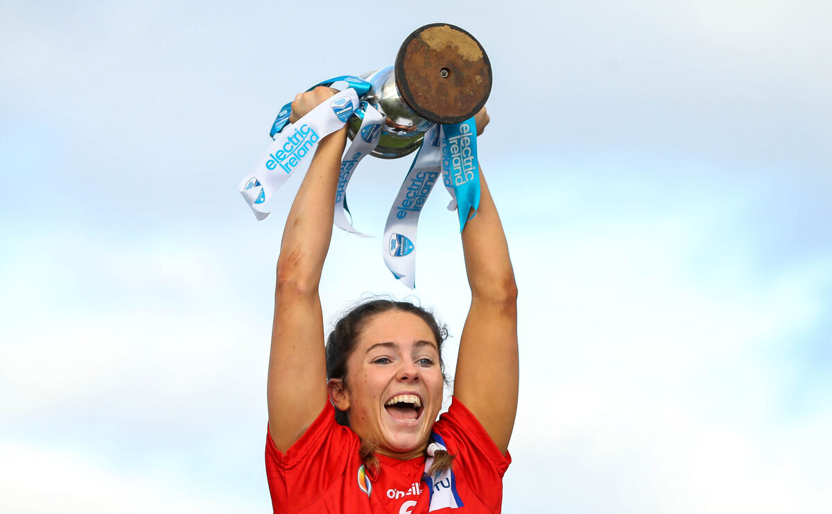 MTU Cork’s Saoirse McCarthy lifts the Purcell Cup. Picture: INPHO/Ryan Byrne
