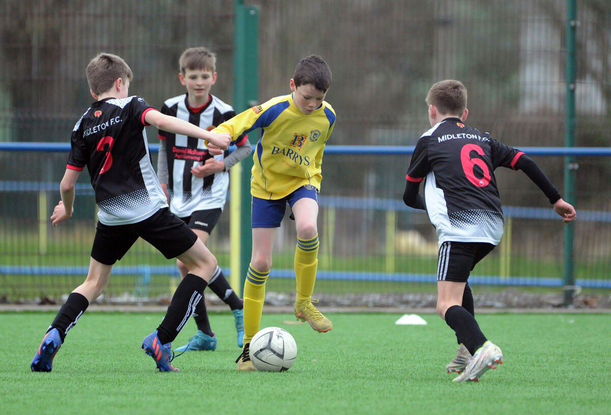 Midleton players Harry Jowarski and Cathal Lynch trying to dispossess Douglas Hall's George O'Mahony in the Blackwater Motors Under 12 Premier game at Moneygourney. Midleton players Harry Jowarski and Cathal Lynch trying to dispossess Douglas Hall's George O'Mahony in the Blackwater Motors Under 12 Premier game at Moneygourney.