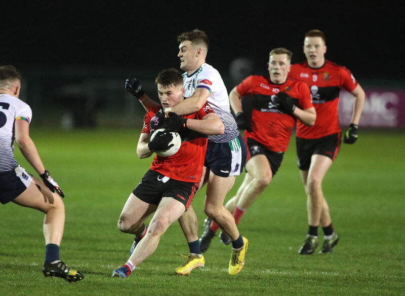 UCC forward Fionn Herlihy breaks past UL's Paul Keaney. Picture: Patrick Browne