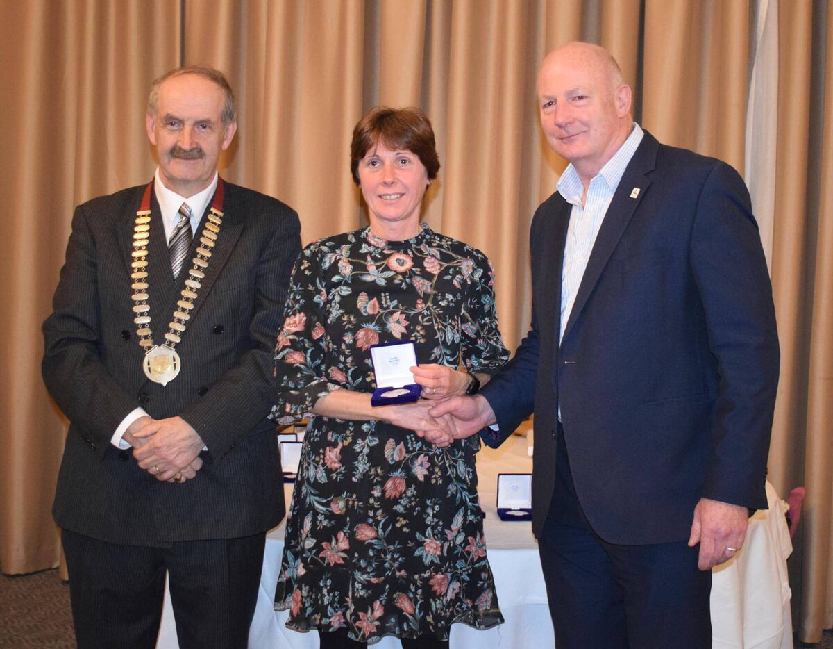 Breda Gaffney of Mallow AC receiving her International Award from Hamish Adams, CEO of Athletics Ireland. Also pictured is Pat Walsh, Chairman, Cork Athletics Board. Picture: John Walshe Breda Gaffney of Mallow AC receiving her International Award from Hamish Adams, CEO of Athletics Ireland. Also pictured is Pat Walsh, Chairman, Cork Athletics Board. Picture: John Walshe