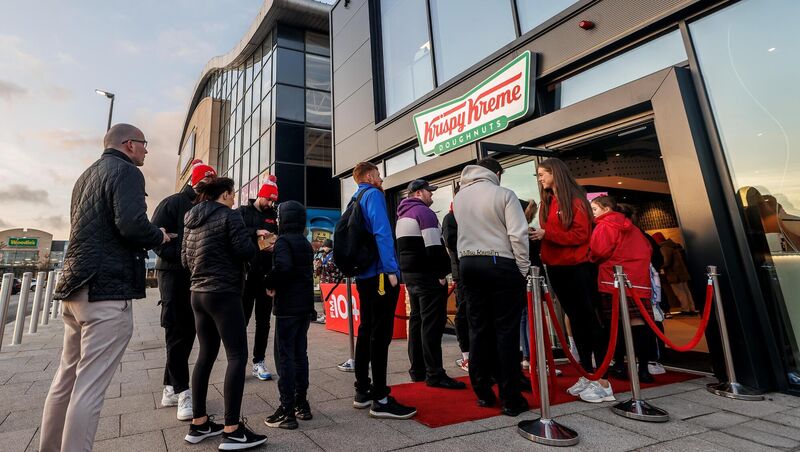 People queue at the opening of the new Krispy Kreme Shop at Carrickmines Park, Dublin