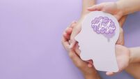 Adult and child hands holding encephalography brain paper cutout,autism, Stroke, Epilepsy and alzheimer awareness, seizure disor