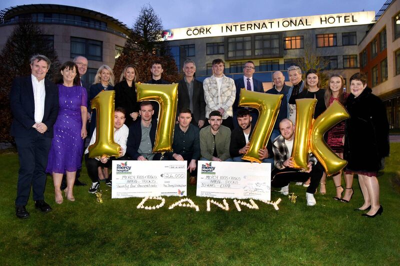 Kneeling: Éanna Desmond, Sam Martin, Paul Moran, Brian Kelleher, Eoghan Riordan and Scott Lonergan, with family and friends of the late Danny Crowley, at a an event where it was announced that the 2022 Danny Crowley Christmas Swim raised €24,002.60 for the Mercy Hospital Foundation’s Kids &amp; Teens Appeal, and in particular the Paediatric Outreach Oncology Nursing Service (POONS), which supports Corks youngest cancer patients. Over the years the swim has raised €177,000 for the charity.	Picture: Adrian O’Herlihy