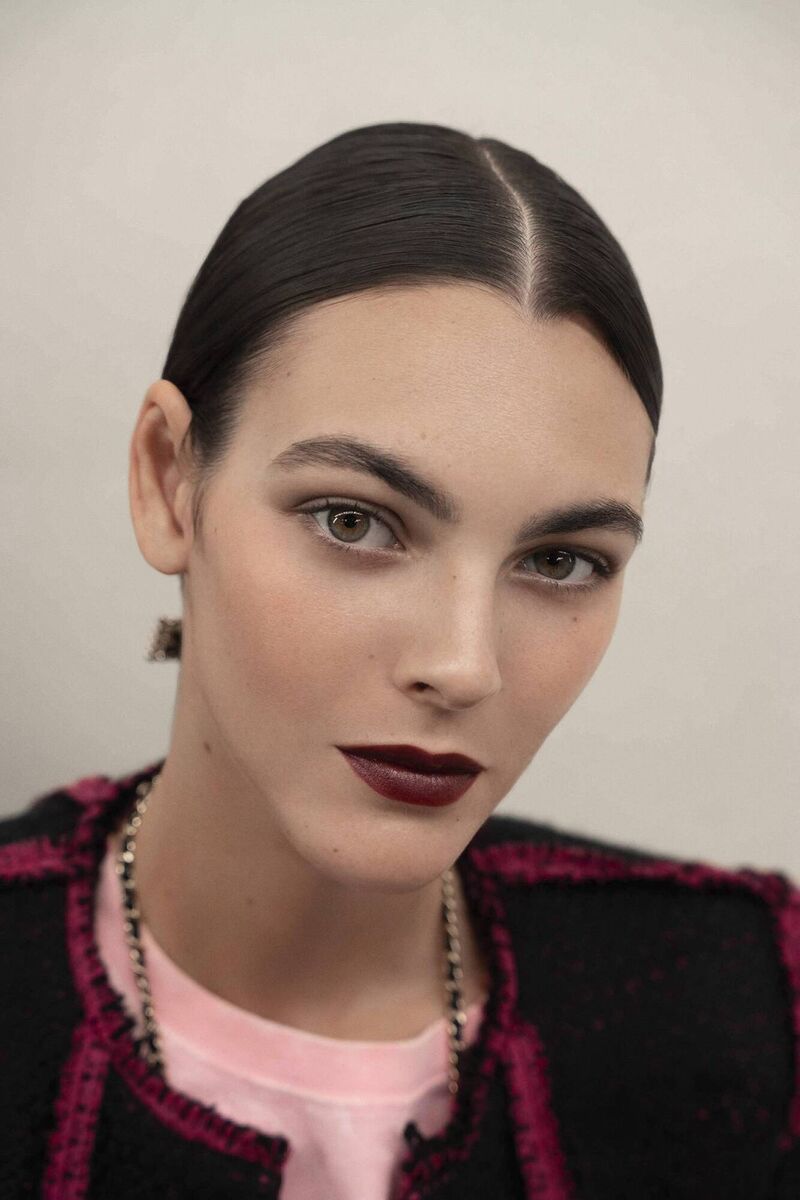 A model backstage at Chanel SS23. A model backstage at Chanel SS23.