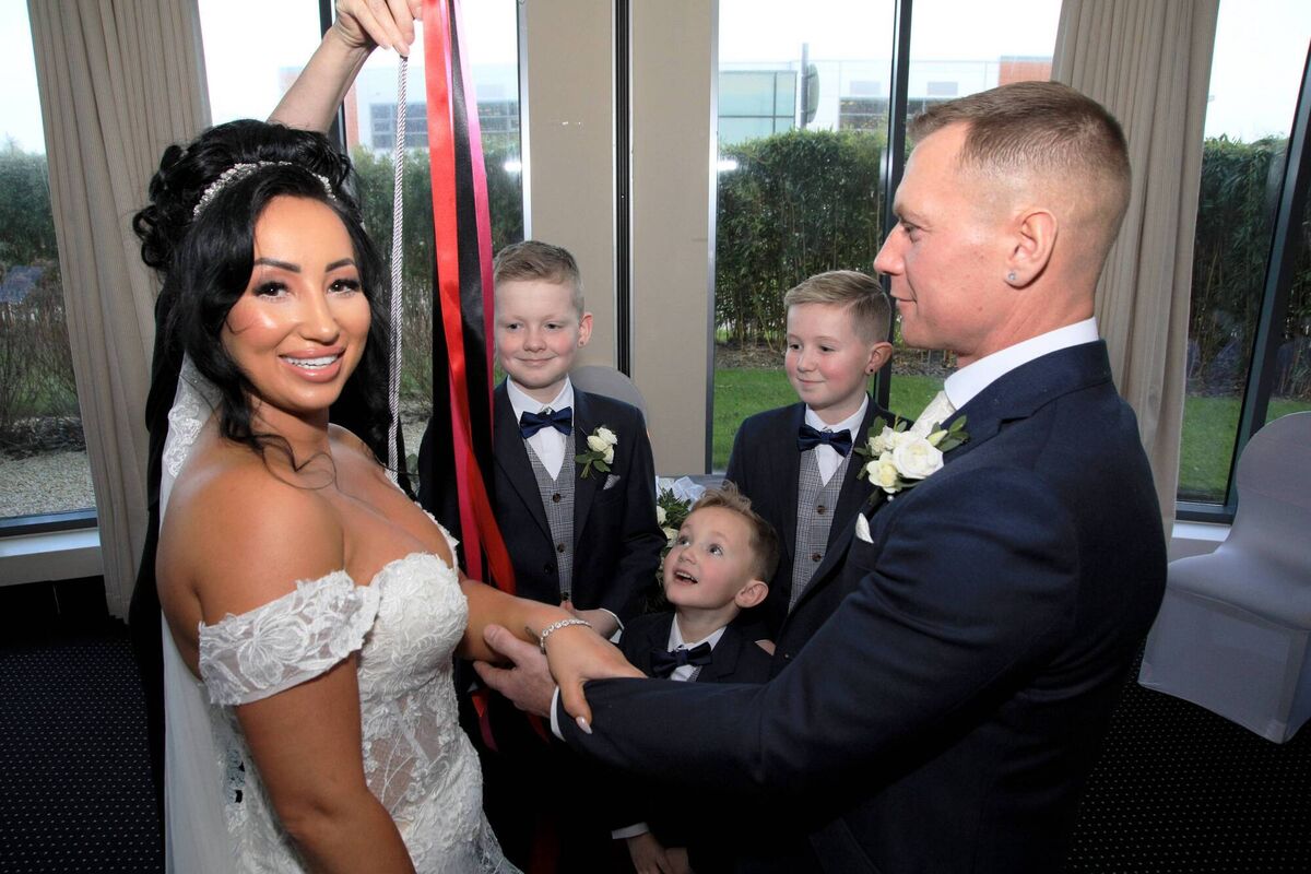 The couple had a ribbon fastening during the ceremony, which involved their sons.