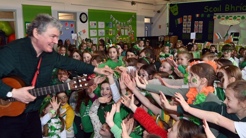 Cork musician John Spillane performs for pupils to mark Seachtain an Gaeilge