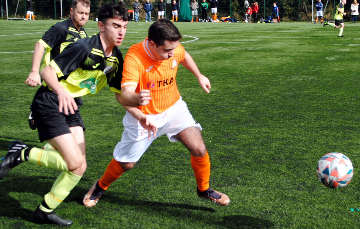 Blackpool Celtic's Cian Madden wins this race for possession in the action against Blackpool Celtic at the Mayfield Community School.