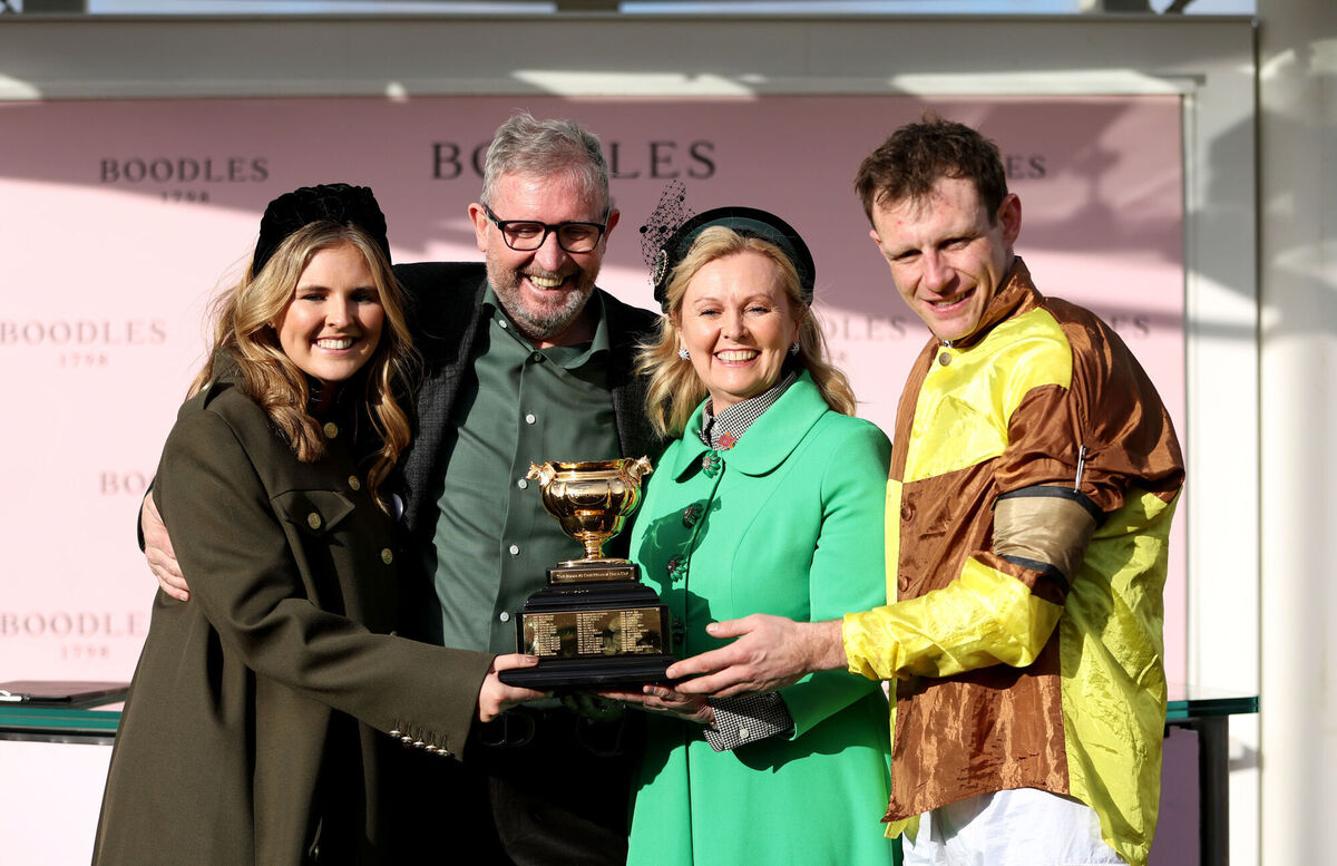 Owner Audrey Turley (second right) and jockey Paul Townend celebrate with the Gold Cup. Picture: Steven Paston/PA Wire Owner Audrey Turley (second right) and jockey Paul Townend celebrate with the Gold Cup. Picture: Steven Paston/PA Wire