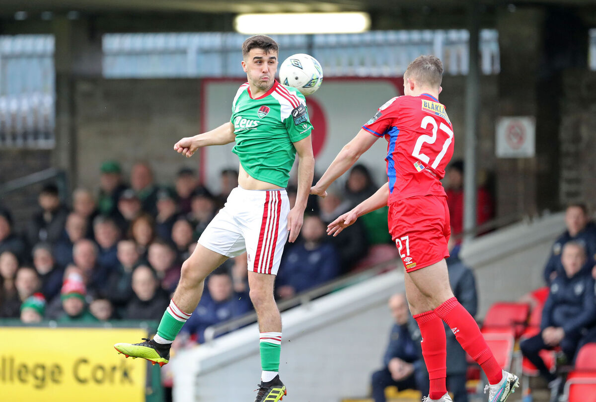  Barry Coffey, Cork City, and Evan Caffrey, Shelbourne, rise high at Turner's Cross on Friday. Picture: Jim Coughlan.