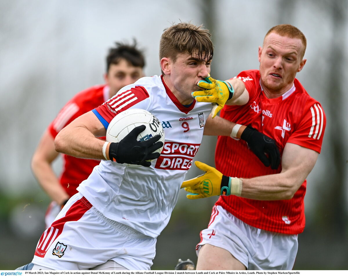 Ian Maguire takes on Donal McKenny of Louth. Picture: Stephen Marken/Sportsfile