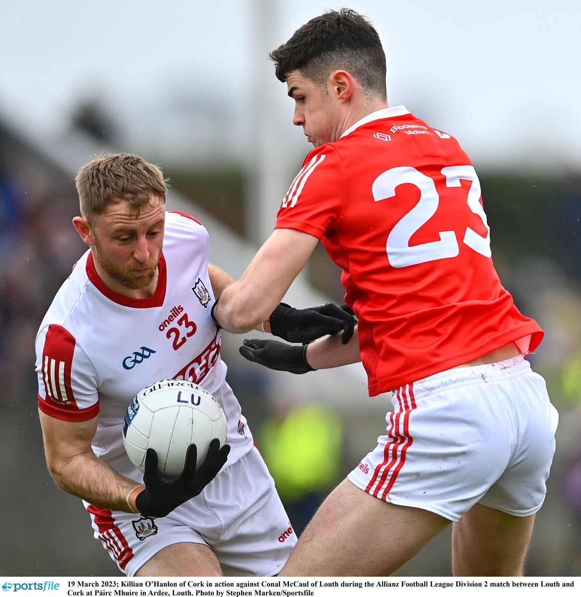 Killian O’Hanlon battles Conal McCaul of Louth. Picture: Stephen Marken/Sportsfile