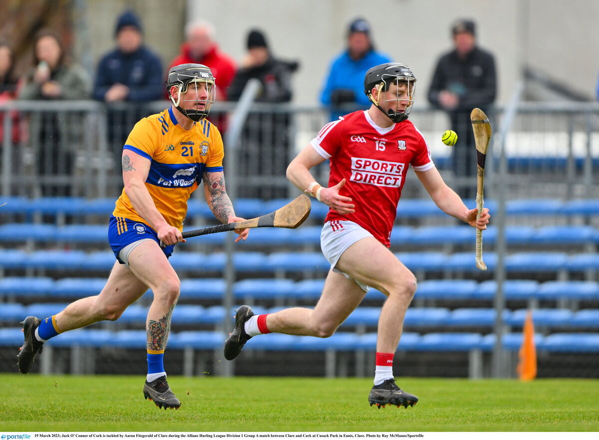 Jack O’Connor of Cork is tackled by Aaron Fitzgerald of Clare. Picture: Ray McManus/Sportsfile
