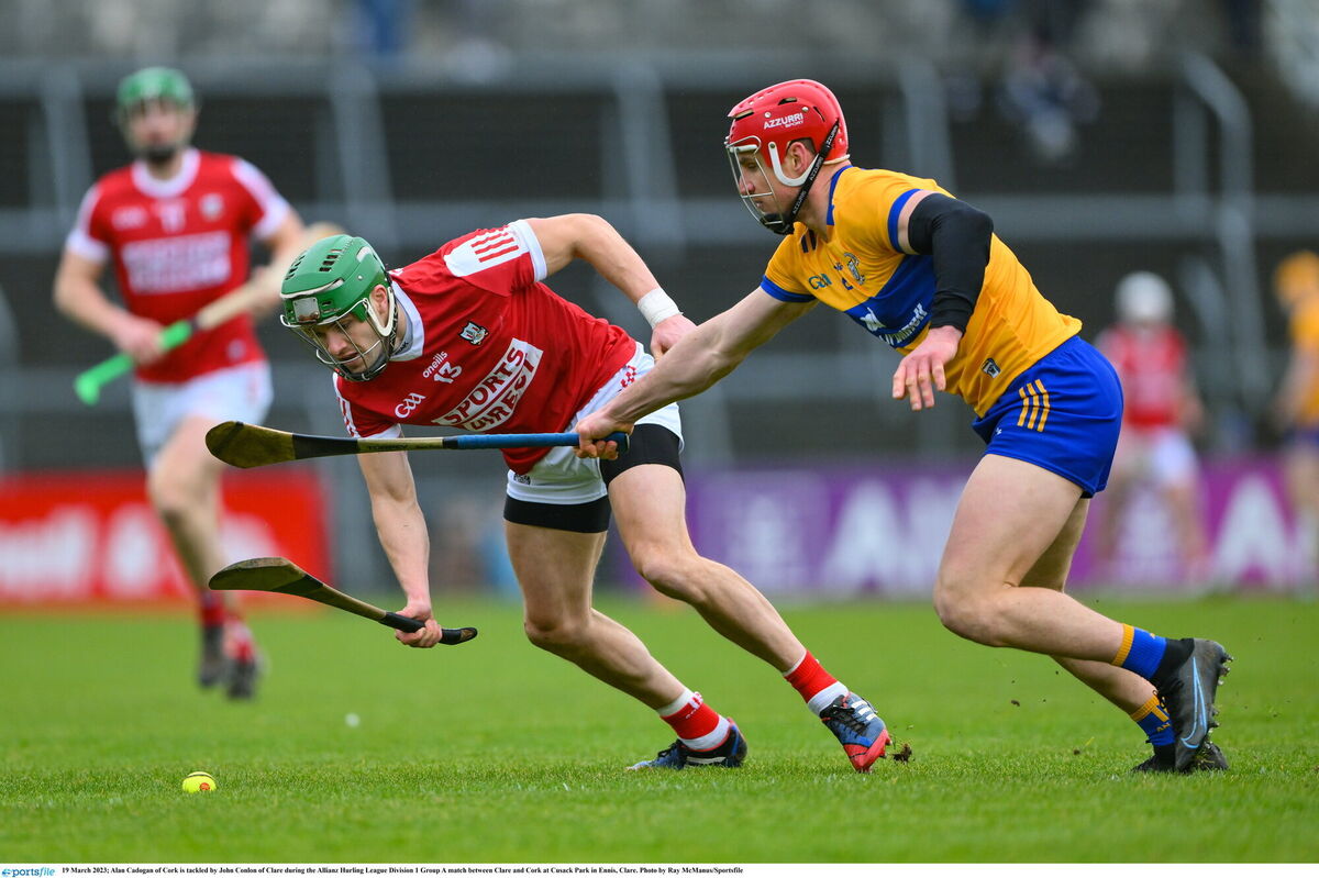 Alan Cadogan of Cork is tackled by John Conlon of Clare. Picture: Ray McManus/Sportsfile