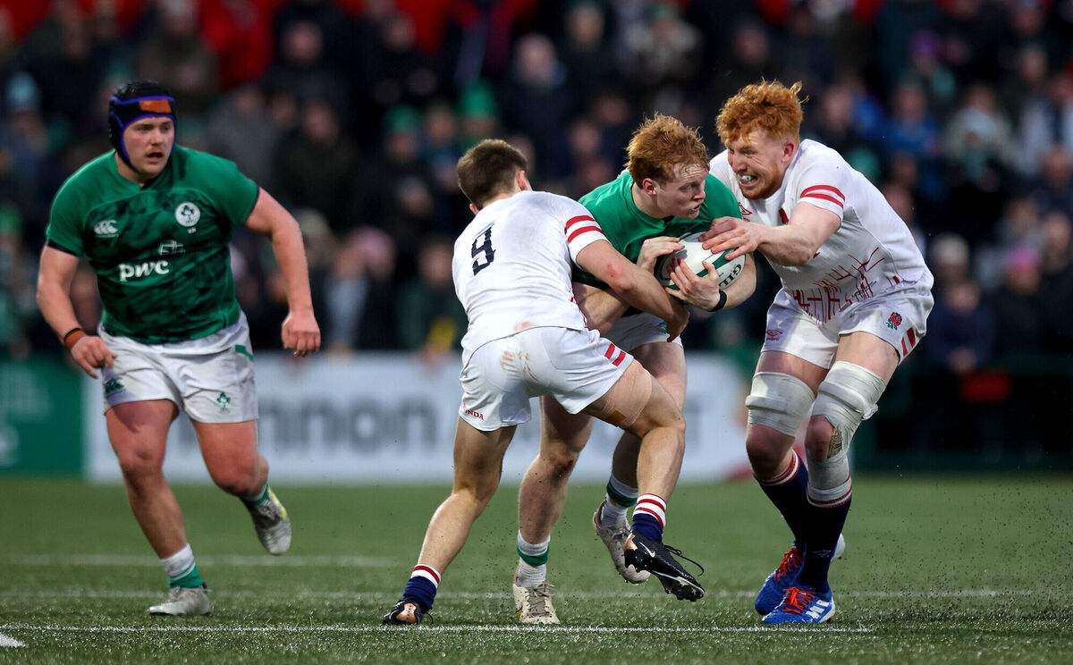 Ireland’s Hugh Cooney with Charlie Bracken and Lewis Chessum of England. Picture: INPHO/Ryan Byrne