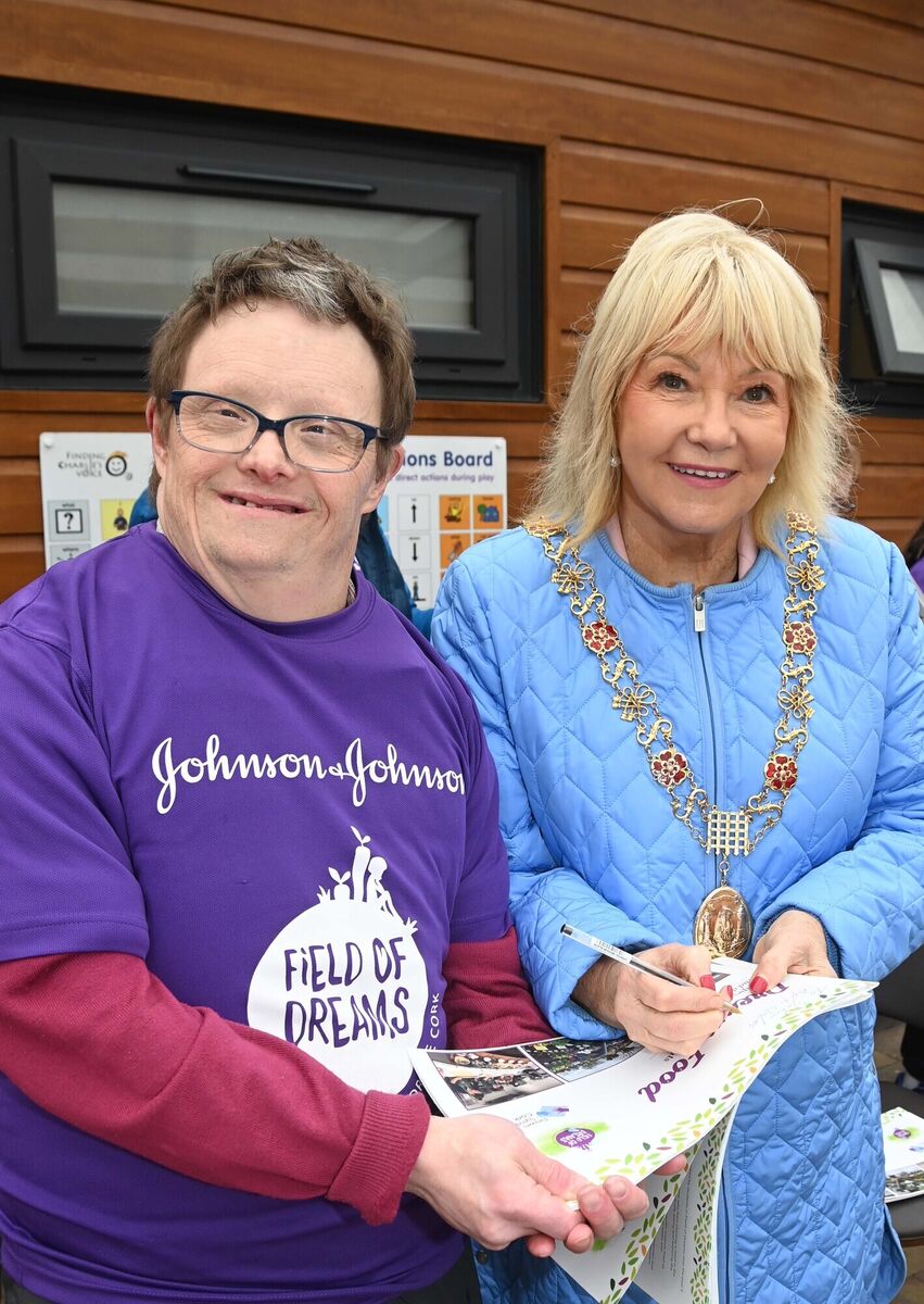 Councillor Deirdre Forde, Lord Mayor of Cork, signing a book for John Sweetnam, one of the students who created recipes for the first cook book, Dream Food, produced by students and staff at Field of Dream, Down Syndrome Cork, launched on World Down Syndrome Day. Councillor Deirdre Forde, Lord Mayor of Cork, signing a book for John Sweetnam, one of the students who created recipes for the first cook book, Dream Food, produced by students and staff at Field of Dream, Down Syndrome Cork, launched on World Down Syndrome Day.