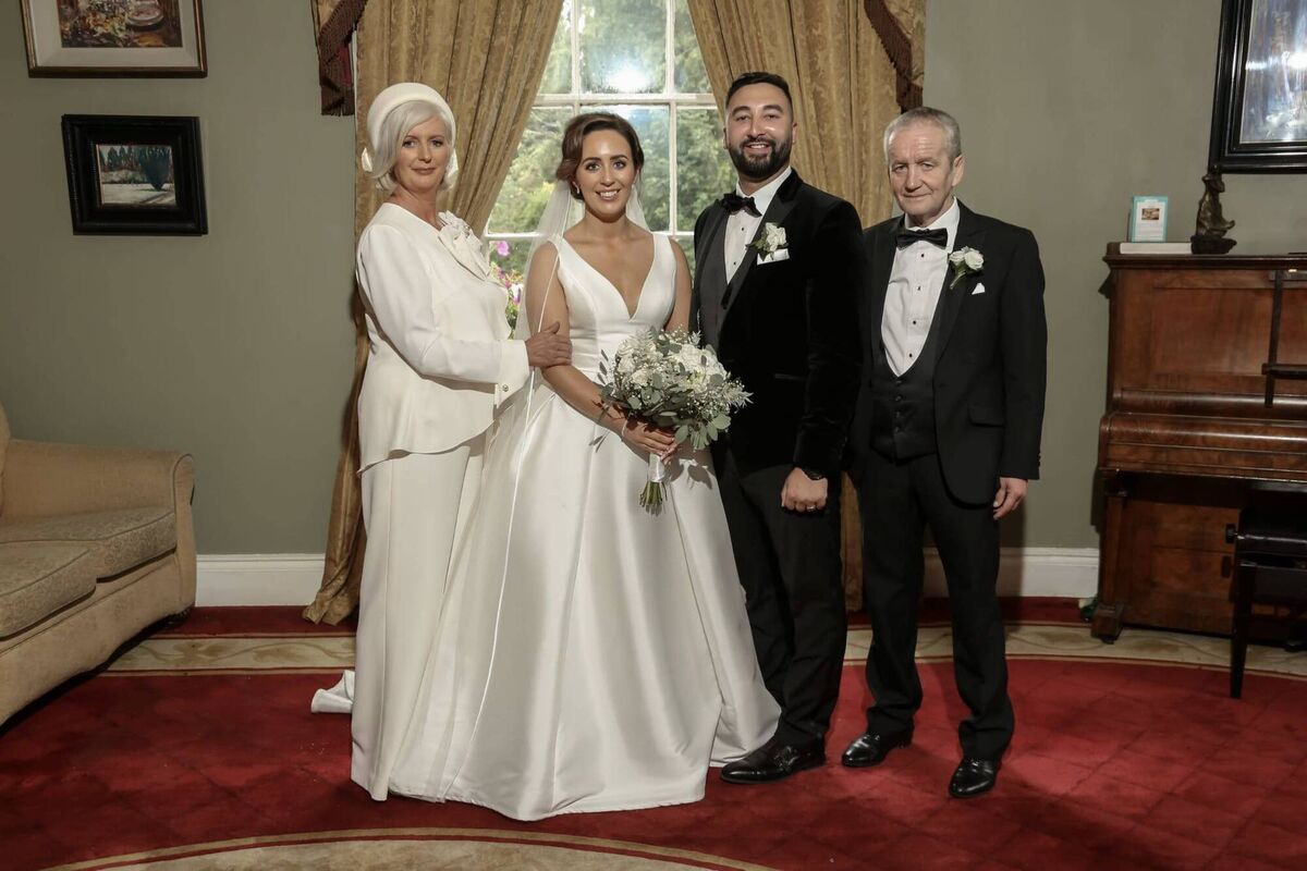 The bride and groom with Sabrina’s parents, on the couple’s wedding day. The bride and groom with Sabrina’s parents, on the couple’s wedding day.