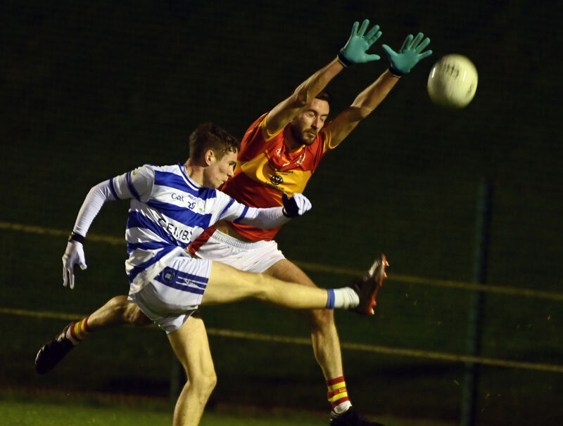 Castlehaven's Michéal Maguire shoots from Éire Óg's Michael Corkery at Ovens. Picture: Eddie O'Hare