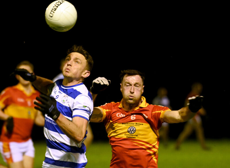 Castlehaven's Mark Collins gathers the ball from Éire Óg's Dermot O'Herlihy during the football league clash at Ovens. Picture: Eddie O'Hare
