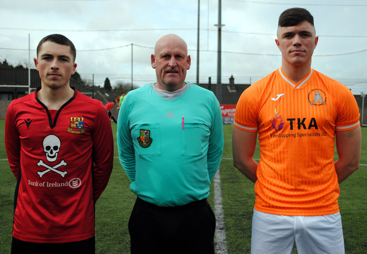 Cathedral Celtic's captain Rob Rourke (left) with UCC's Jamie Keniry, accompanied by referee Richard O'Gorman. Picture: Barry Peelo.
