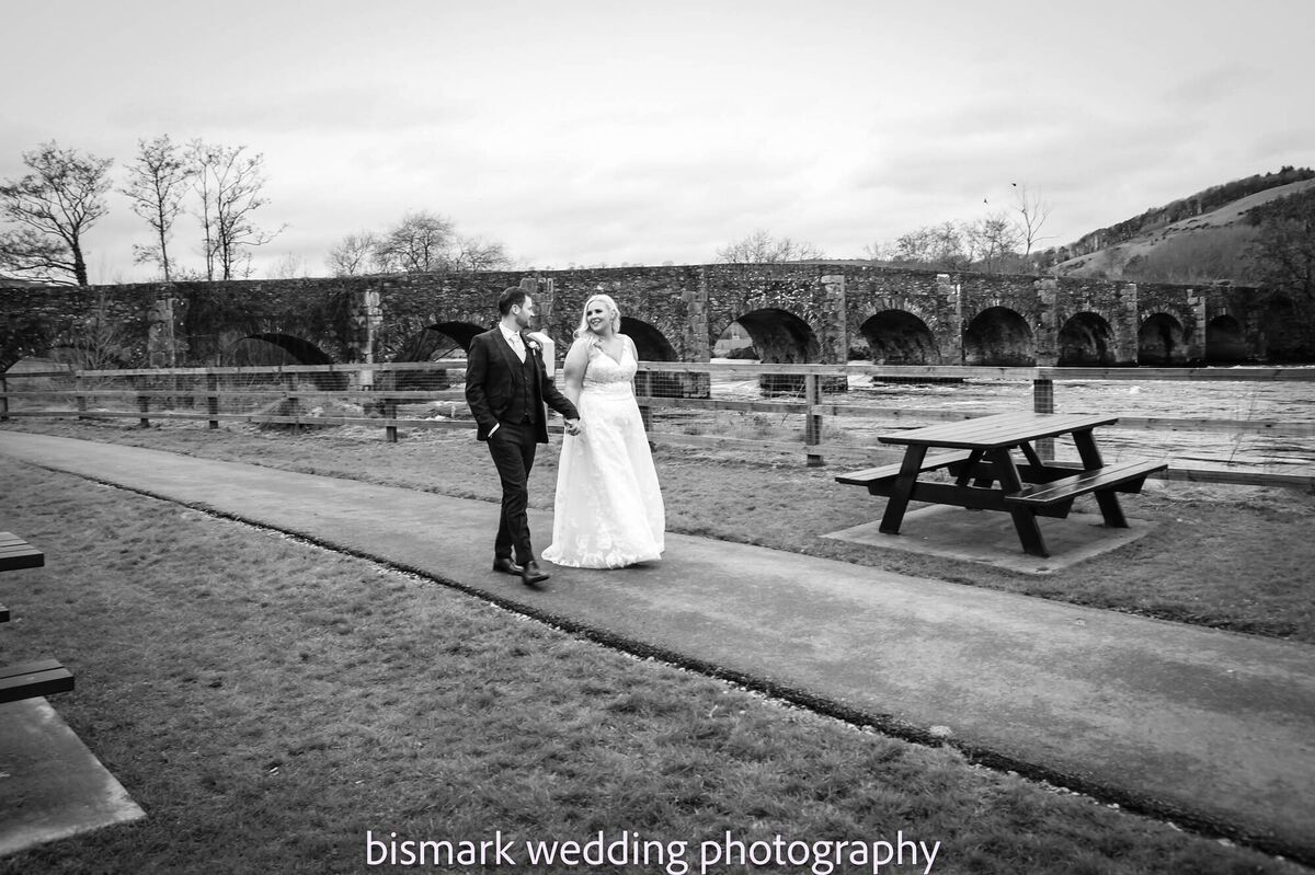 The couple enjoying a walk on their wedding day, where they had some photographs taken by Bismark photographers. The couple enjoying a walk on their wedding day, where they had some photographs taken by Bismark photographers.