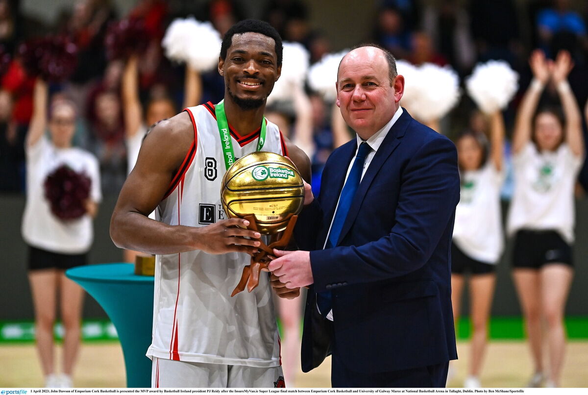 John Dawson of Emporium Cork Basketball is presented the MVP award by Basketball Ireland president PJ Reidy. Picture: Ben McShane/Sportsfile