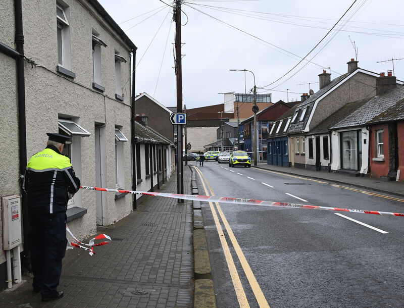 Gardaí at the scene of the fatal house fire in Douglas yesterday. Picture; Eddie O'Hare