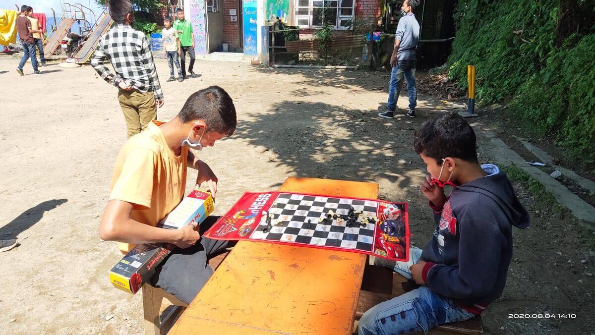 Boys from Edith Wilkins Street Children Foundation playing chess. Boys from Edith Wilkins Street Children Foundation playing chess.