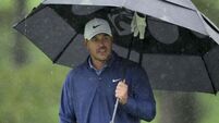 Masters suspended after heavy rain with Brooks Koepka leading the way at Augusta
