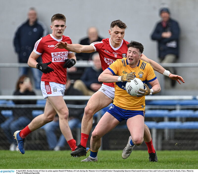 Keelan Sexton of Clare in action against Daniel O'Mahony of Cork. Picture: Piaras Ó Mídheach/Sportsfile