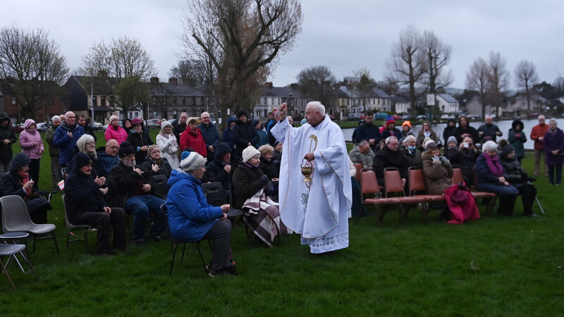 Crowds gather at the Lough for Easter Sunday mass at dawn