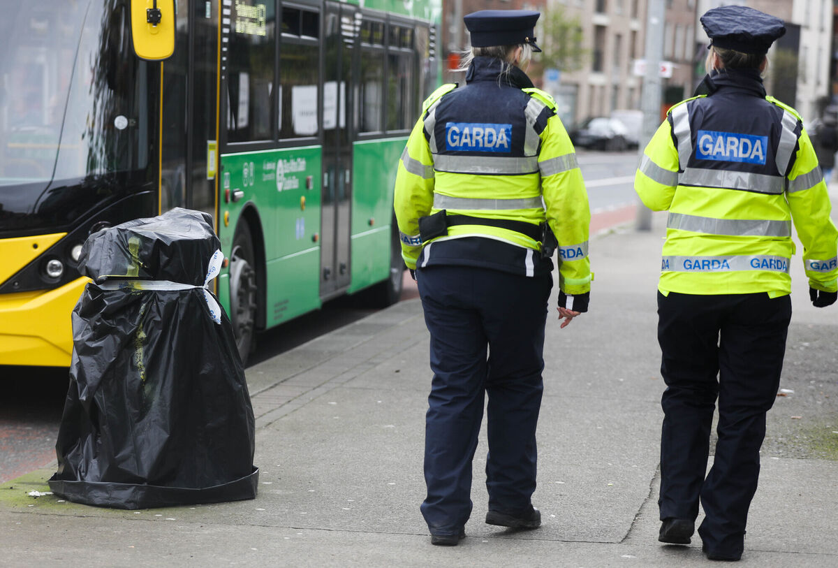 Pictured are Gardai passing a litter bin which has been taped closed as extra security precautions are put in place ahead of the visit of US President Joe Biden this week.. Photographer: Leah Farrell / RollingNews.ie Pictured are Gardai passing a litter bin which has been taped closed as extra security precautions are put in place ahead of the visit of US President Joe Biden this week.. Photographer: Leah Farrell / RollingNews.ie