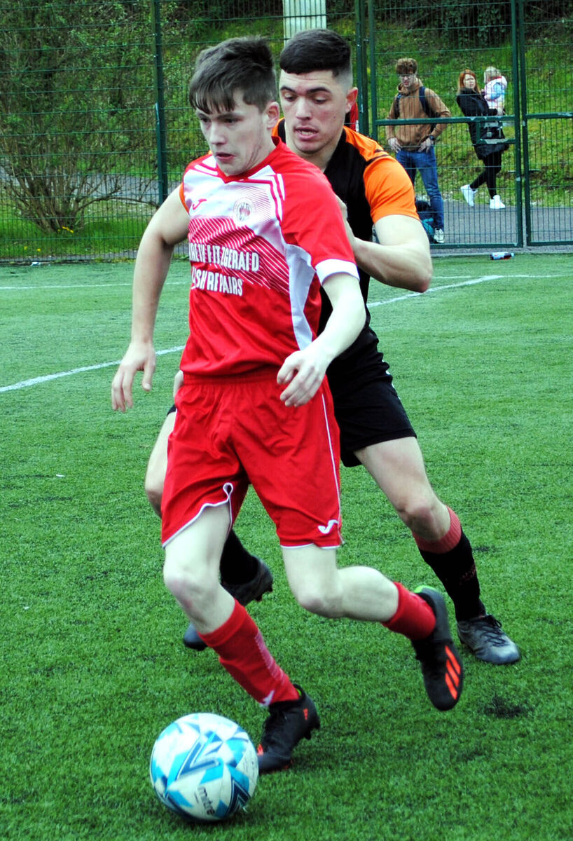 Village United's Dean Hickey comes away with possession against Cathedral Celtic. Picture: Barry Peelo. Village United's Dean Hickey comes away with possession against Cathedral Celtic. Picture: Barry Peelo.