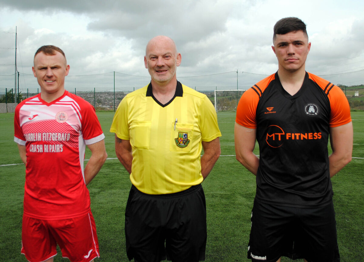Cathedral Celtic's Robbie Rourke (right) with Village United's Anthony Kiniry, accompanied by referee Denis Cronin. Picture: Barry Peelo. Cathedral Celtic's Robbie Rourke (right) with Village United's Anthony Kiniry, accompanied by referee Denis Cronin. Picture: Barry Peelo.