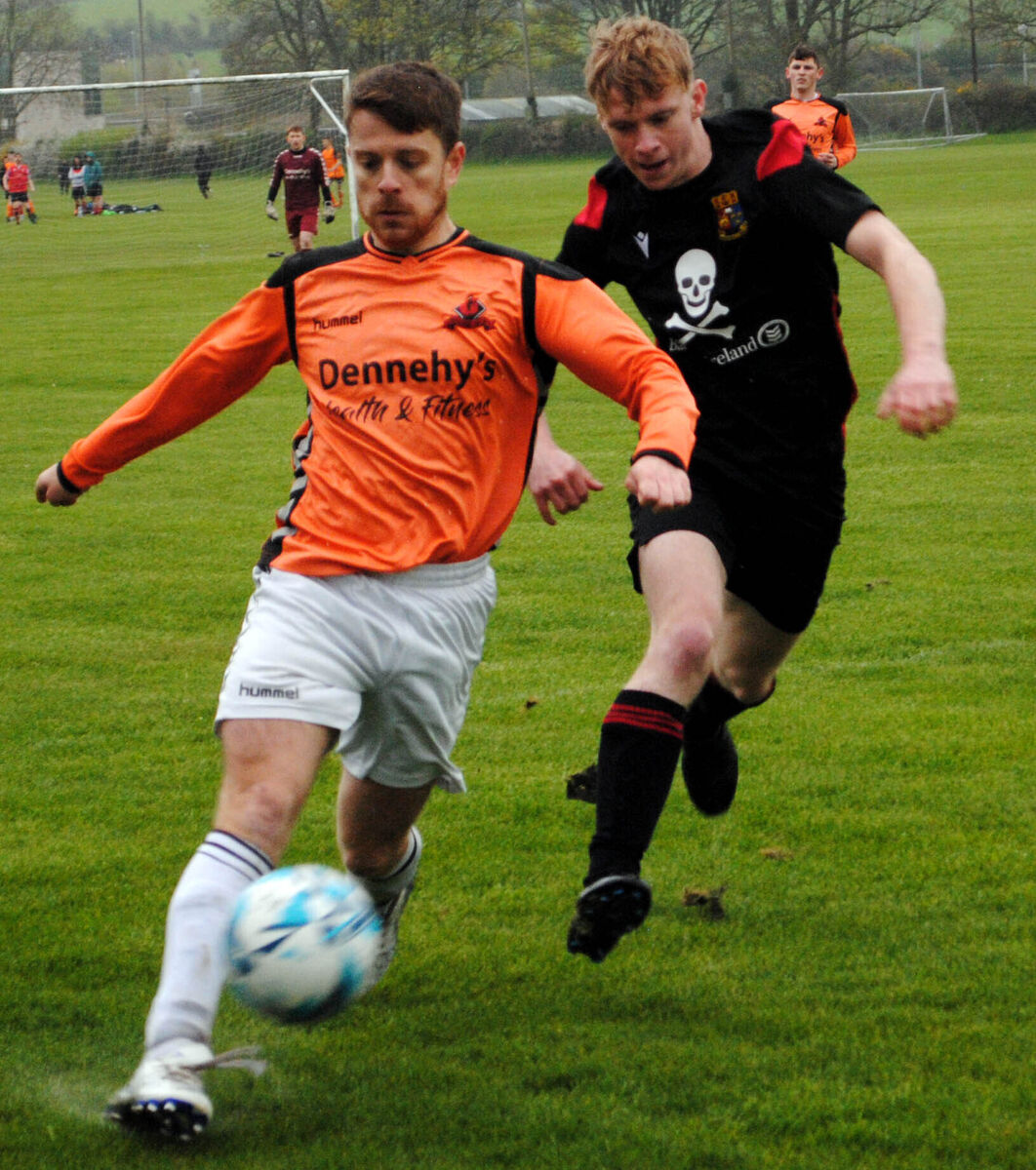 Grangevale's Gregg Barry gets his clearance away as UCC's Liam Hogan closes in. Picture Barry Peelo. Grangevale's Gregg Barry gets his clearance away as UCC's Liam Hogan closes in. Picture Barry Peelo.