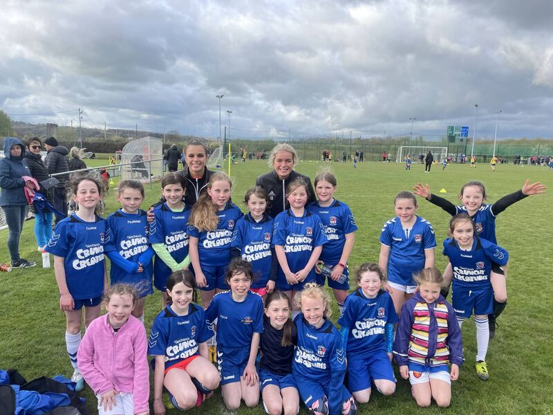 Cork City women’s players Jesse Mendez, Niamh Cotter, Alix Mendez and Heidi Mackin with Wilton U10 (Shield winners).