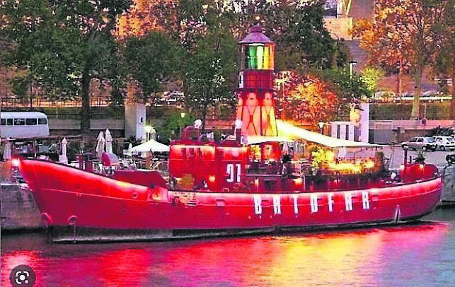 Le Batofar in Paris, a trendy nightclub, moored on the Seine, which used to be the Cork lightship, the Osprey Le Batofar in Paris, a trendy nightclub, moored on the Seine, which used to be the Cork lightship, the Osprey