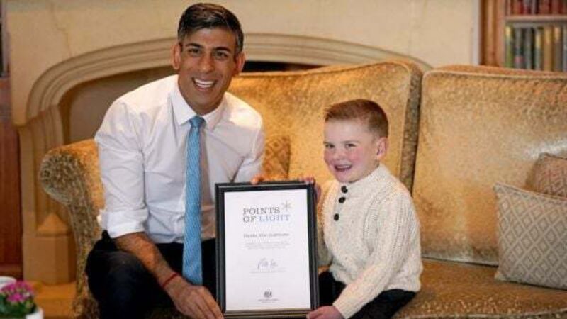 Six-year-old Dáithí ribs Sunak over Ireland’s rugby win as he receives special award