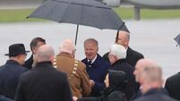 Biden braves wet and windy conditions on arrival at Dublin Airport