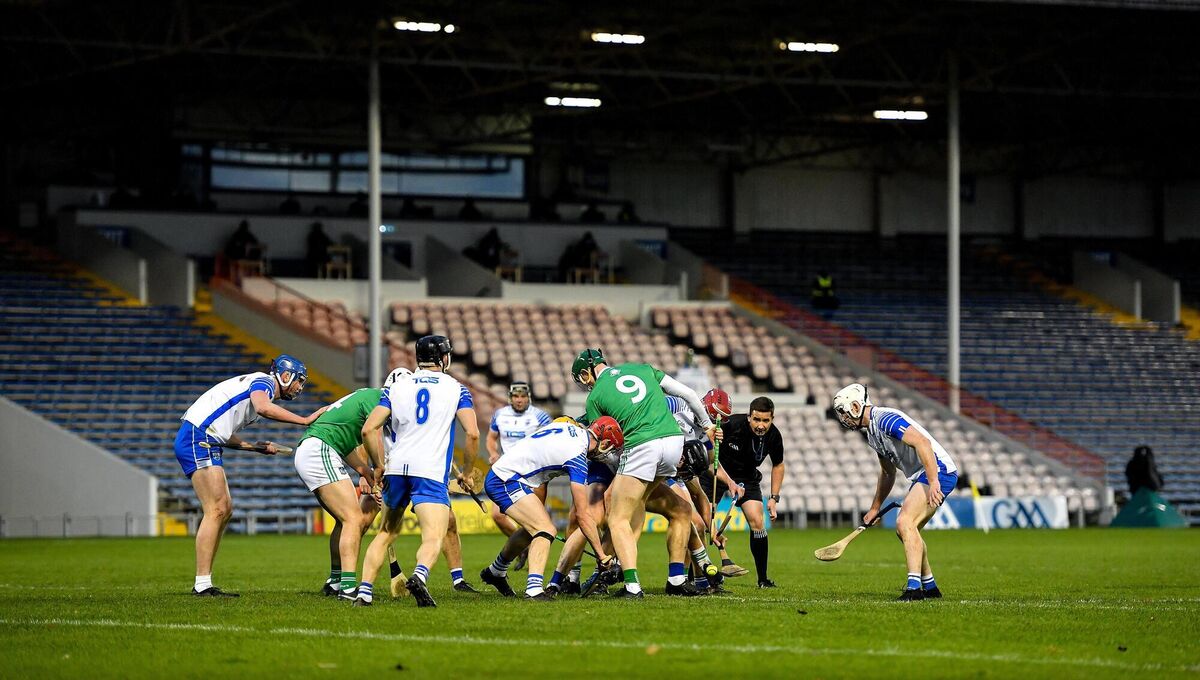 Referee Colm Lyons looks on as players contest a loose sliotar during the 2020 Munster final between Limerick and Waterford at Semple Stadium. Picture: Brendan Moran/Sportsfile