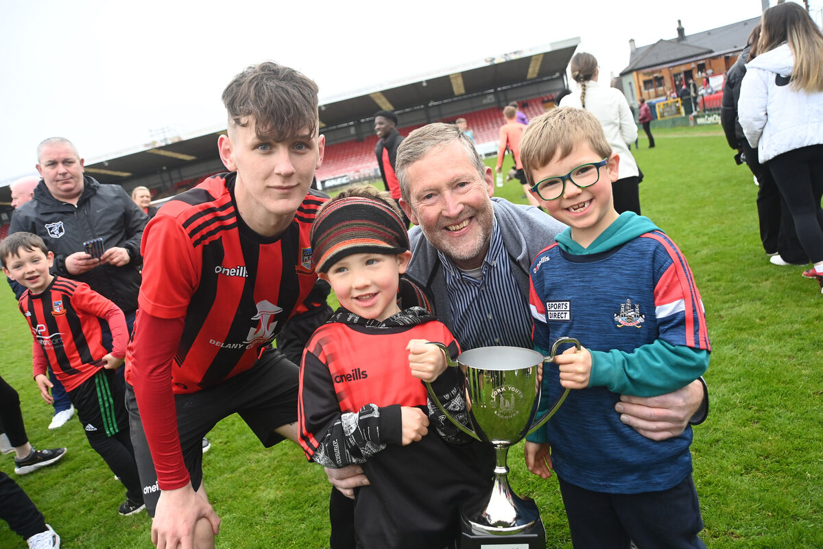  Ringmahon Rangers captain Adam Delurey with club sponsor Ray O'Mahony of The Red Cove Inn and grandchildren Loughlin and Cian O'Mahony following their win in the Daly Industrial Supplies Cork Youth Leagues Under-19 Cup Final, Ringmahon Rangers vs Avondale United at Turner's Cross, Cork. Pic: Larry Cummins