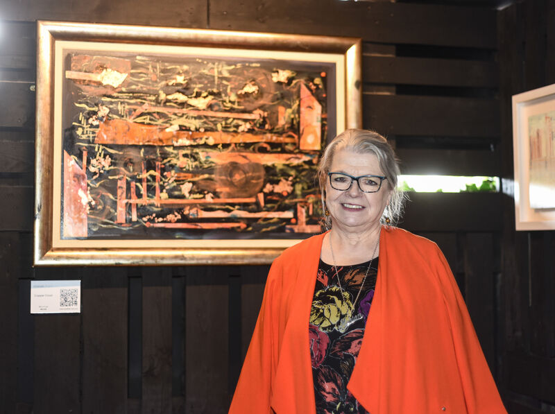 Marion Wyatt pictured with her piece 'Copper Coast' at the opening of "Not So Black and Wyatt" - a first-time collective exhibit at the Black Market, Cork City. Picture: Cian O'Regan.