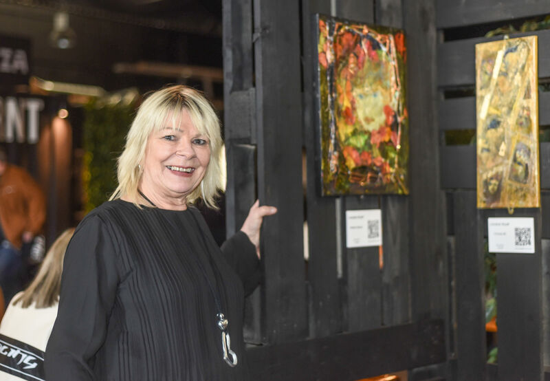 Lorraine Wyatt pictured with her artwork at the opening of "Not So Black and Wyatt" - a first-time collective exhibit at the Black Market, Cork City. Picture: Cian O'Regan.
