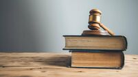 wooden judge on book on the desk