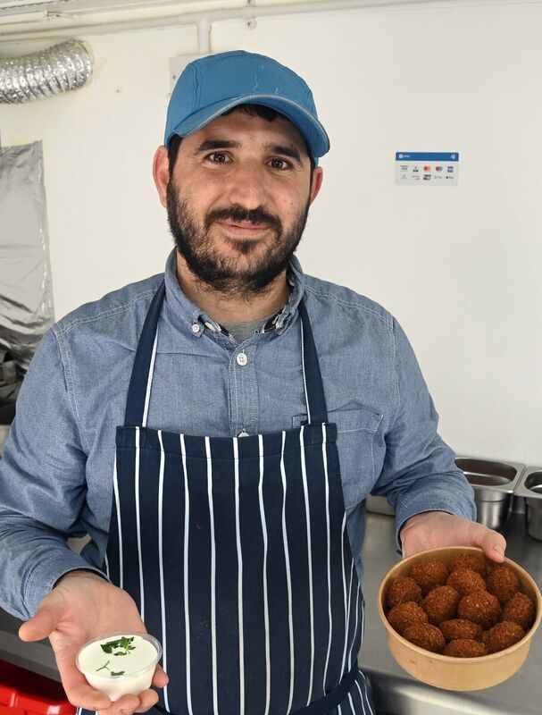 Abdul Alhasan, chef, with a falafel box and tahini sauce in his Cork Falafel truck in Carrigaline. Abdul Alhasan, chef, with a falafel box and tahini sauce in his Cork Falafel truck in Carrigaline.