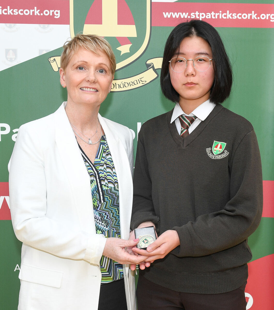 Eva Liu receives her award from The Echo columnist Linda Mellerick, at the annual awards night of St Patrick’s College, Gardiner's Hill. Eva Liu receives her award from The Echo columnist Linda Mellerick, at the annual awards night of St Patrick’s College, Gardiner's Hill.