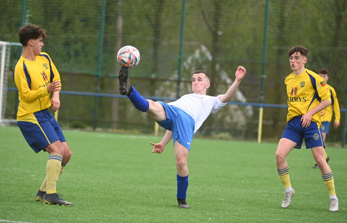  Sean O'Kelly at full stretch for Carrigaline United as he attempts to stay in control of the ball against Douglas Hall. Picture: Larry Cummins.