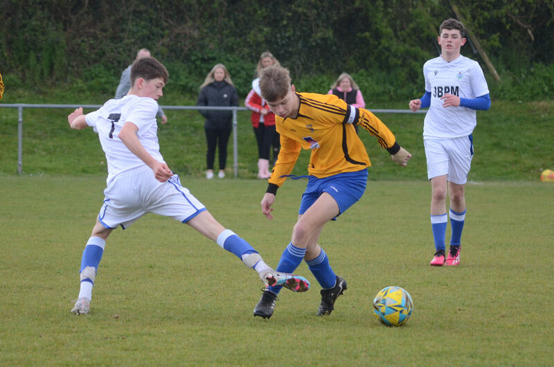 Corinthians Boys A's captain Aaron Murphy evades the challenge from Kinsale's Joey Hogan during the recent U16 Cup match at Castletreasure. Picture: Howard Crowdy Corinthians Boys A's captain Aaron Murphy evades the challenge from Kinsale's Joey Hogan during the recent U16 Cup match at Castletreasure. Picture: Howard Crowdy