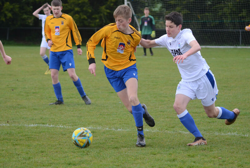 Ryan Mullin of Corinthians Boys A attempts to break away from Kinsale's Aaron Walton at the U16 Cup match at Castletreasure. Picture: Howard Crowdy Ryan Mullin of Corinthians Boys A attempts to break away from Kinsale's Aaron Walton at the U16 Cup match at Castletreasure. Picture: Howard Crowdy