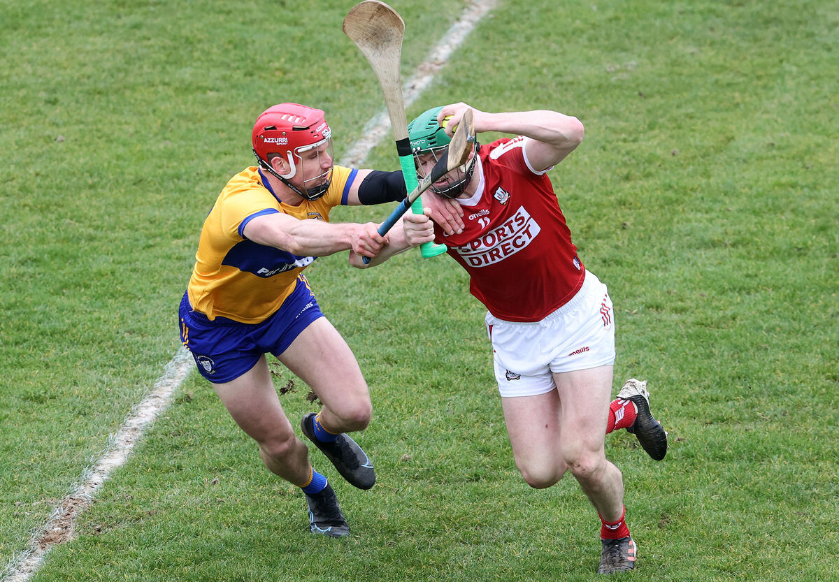 Clare's John Conlon and Seamus Harnedy of Cork in action. Picture: INPHO/Bryan Keane